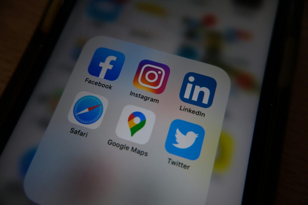 Close-up view of popular social media app icons on a smartphone screen.